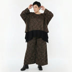 Jacquard Überwurf in schwarzcognacorange mit Kringelmuster oversized Rundhals Langarm