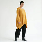Senffarbenes A-LinienShirt aus weichem Stretchjersey mit Rundhals Langarm Saumschlitzen