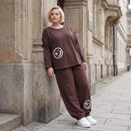 Lässige Oversizedhose aus French Terry mit Smileyprint und gesmoktem Saum extra lang