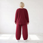Oversized French Terry Hose in Schwarz mit Smileyprint gesmoktem Saum und weitem Bein