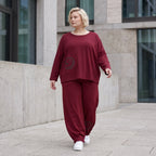 Oversized French Terry Hose in Schwarz mit Smileyprint gesmoktem Saum und weitem Bein