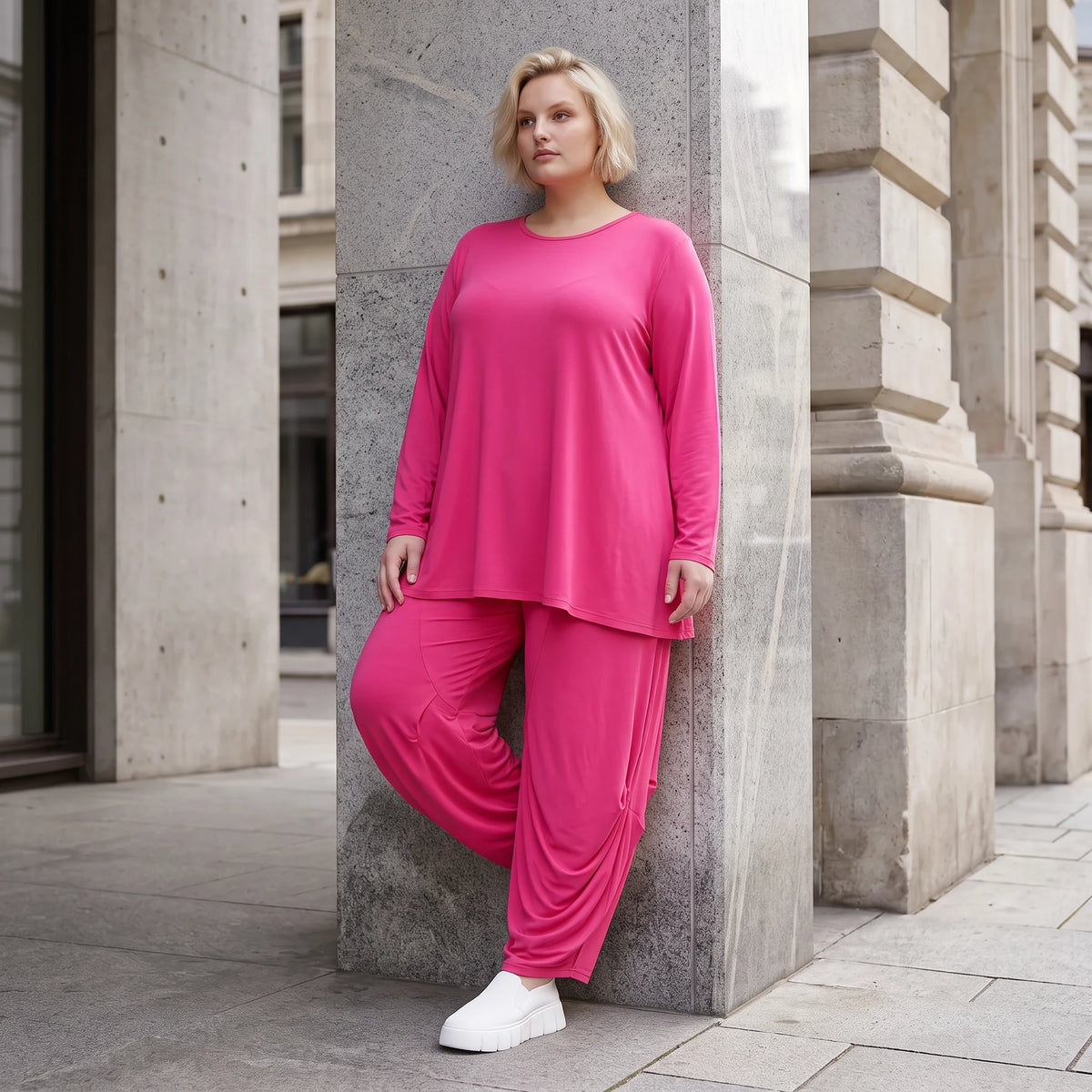 Pinkes Langarmshirt in Glockenform aus softer Slinkyqualität mit Rundhalsausschnitt