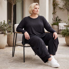 Schwarzes Langarmshirt aus Slinky in Glockenform mit Rundhalsausschnitt elastisch Basic