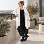 Creme Strickcardigan aus Baumwolle mit Stehkragen Taschen und A-Linie in Glockenform