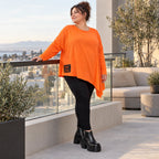 Orange Langarmshirt aus weichem Stretchjersey mit asymmetrischem Schnitt und Zipfelsaum