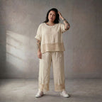 Zeitlose Creme Leinenhose im leger Lagenlook mit Strickdetails und Komfortbund Sommerfit